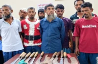 আদালতে অস্ত্রসহ ১১ জন আটক